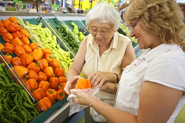 older woman shopping with female friend