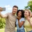 summer-friends-taking-a-selfie-in-a-park